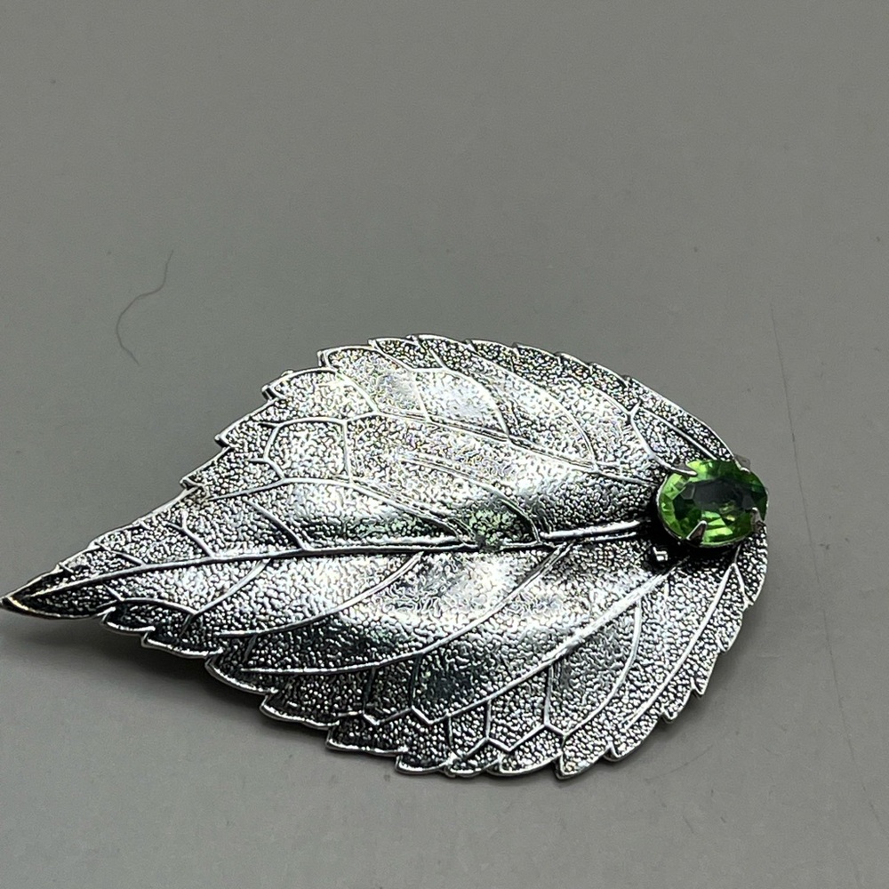 Silver Leaf Brooch with Green Gem